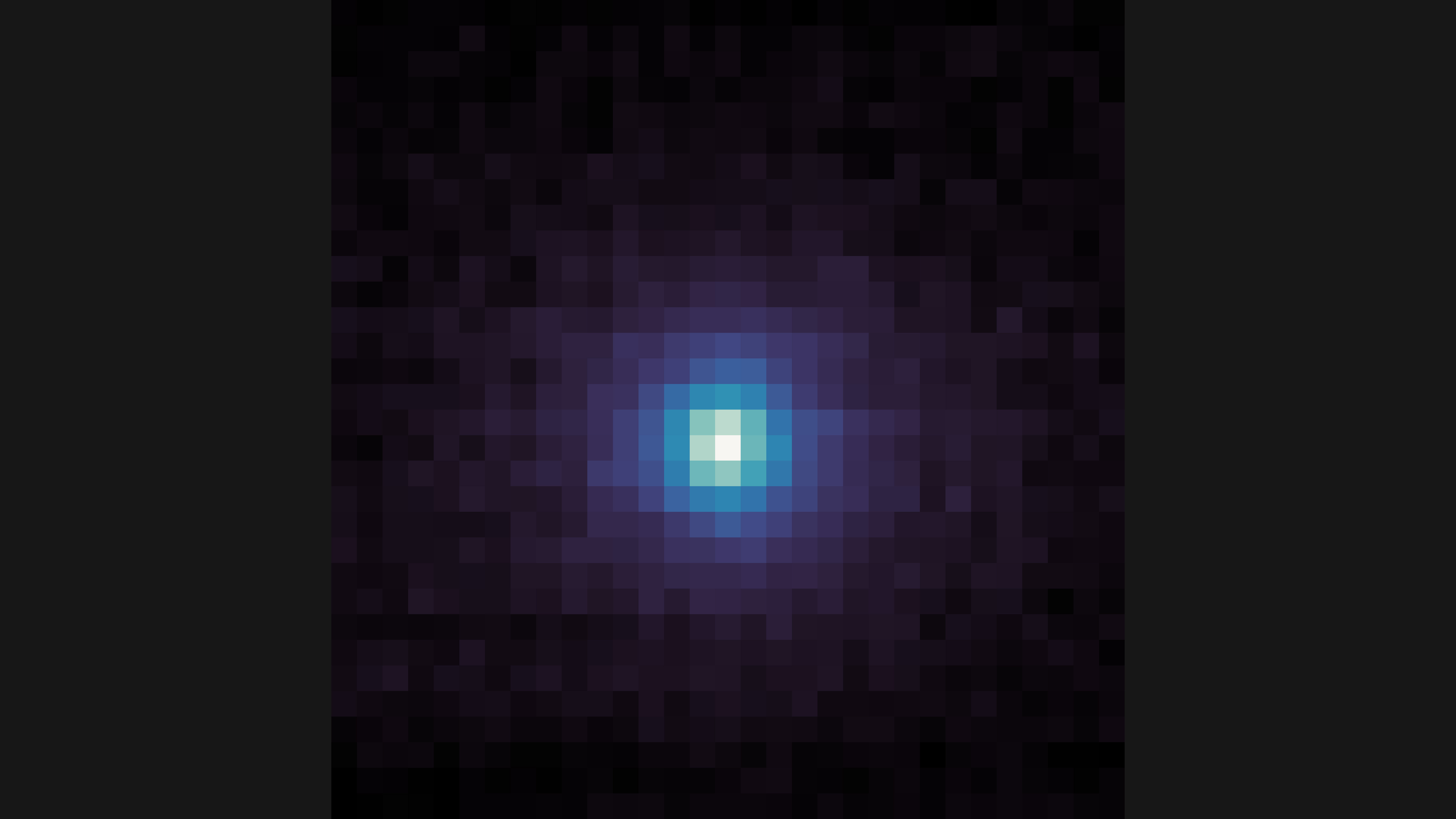 A square, pixelated image with a dark background. At the center is a roughly circular cluster of bright pixels, transitioning from white at the very center to light blue, then darker blue and purple as it spreads outward. The edges and corners of the image are mostly dark purple and black pixels.